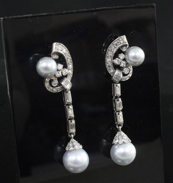 A pair of white gold diamond and Tahitian cultured pearl drop earrings, 52mm.